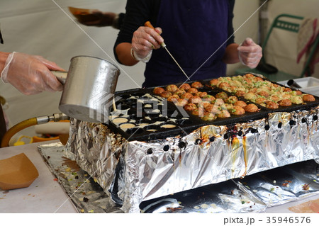 the cook pours a dough for Japanese balls the cook pours a dough for Japanese balls 35946576