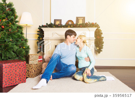 Couple spending Christmas together at home Couple spending Christmas together at home 35956517