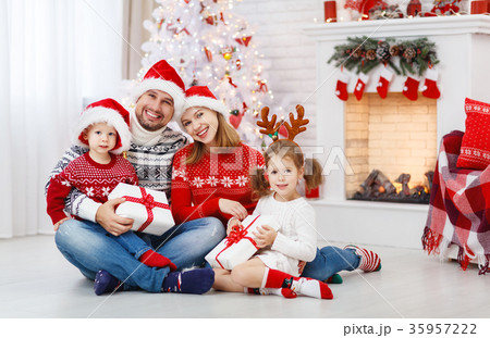 happy family mother father and children on Christmas morning happy family mother father and children on Christmas morning 35957222