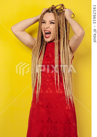 beautiful young woman in red dress tears her hair 35962561
