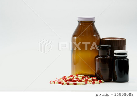 Antibiotic capsule pills and amber bottles Antibiotic capsule pills and amber bottles 35968088