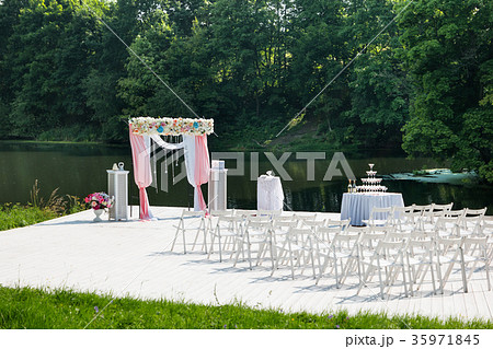 Beautiful floral arch for wedding ceremony. Beautiful floral arch for wedding ceremony. 35971845
