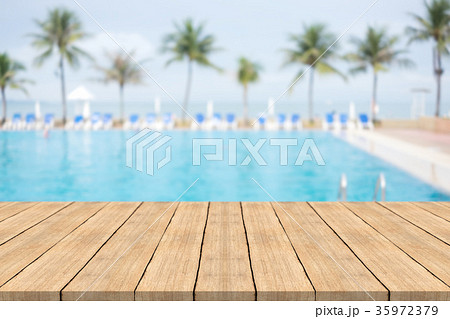 Empty wooden table in on blurred background Empty wooden table in on blurred background 35972379