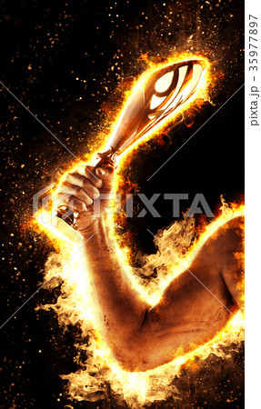 Man's hand in a fire is holding gold cup. Winner 35977897