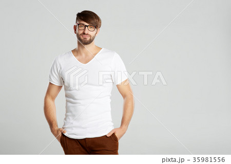 Handsome young man posing at studio 35981556