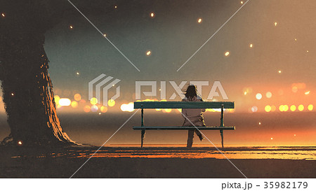 young woman sitting on a bench with bokeh light young woman sitting on a bench with bokeh light 35982179