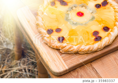 Fruit pizza with pineapple, orange, kiwi, cherry 35983337