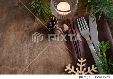 Rustic Christmas table setting with candle. 35984529