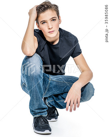 Photo of teenage handsome guy posing at studio 35985086