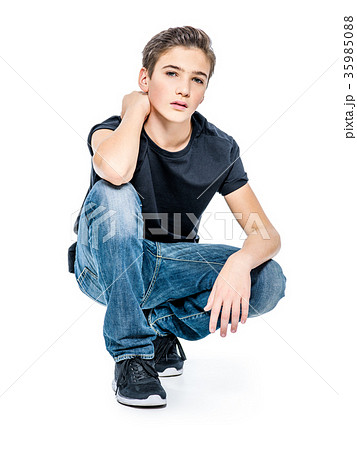 Photo of teenage handsome guy posing at studio Photo of teenage handsome guy posing at studio 35985088