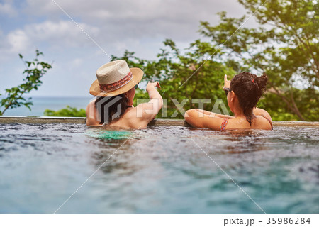 Back view on two girl in pool 35986284