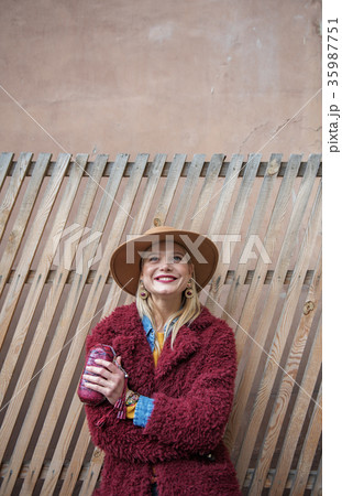 Joyful blond lady resting on street 35987751