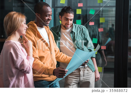 Optimistic professional team is exchanging Optimistic professional team is exchanging 35988072