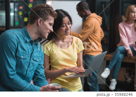 Pleasant young professionals are organizing 35988246