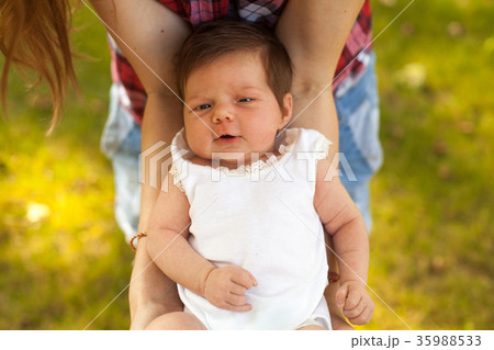 Mother holding her baby in hands Mother holding her baby in hands 35988533