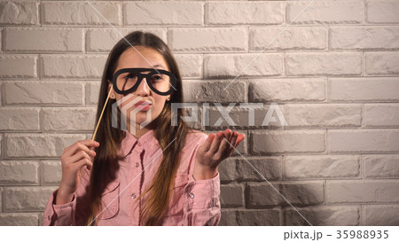 Girl holding a banner with black glasses 35988935