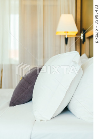 Comfortable pillow on bed Comfortable pillow on bed 35993483