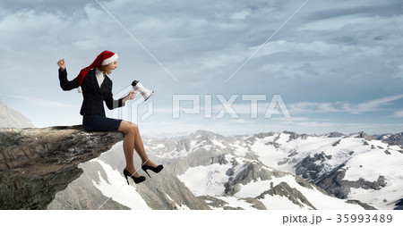 Female Santa with megaphone Female Santa with megaphone 35993489
