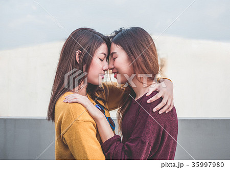 Asia lesbian LGBT Couple hug and nose kiss 35997980