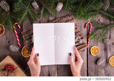 Female hand writing a letter to Santa   36000402