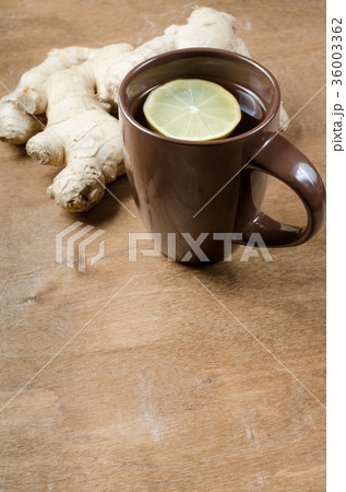 Hot ginger tea with lemon. Alternative medicine. 36003362