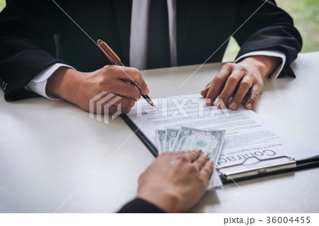 Bribery and corruption concept, bribe in the form of dollar bill 36004455