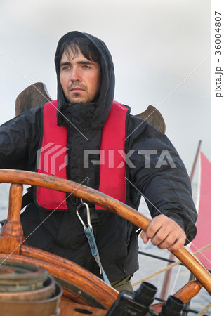 Young sailor steering tall ship Young sailor steering tall ship 36004807
