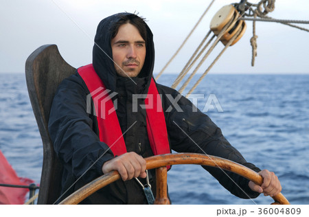 Young sailor steering tall ship Young sailor steering tall ship 36004809