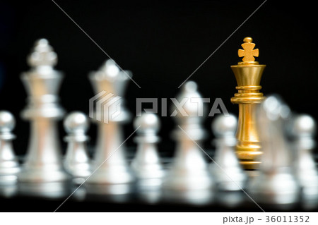 Gold king in chess game face with the silver team 36011352