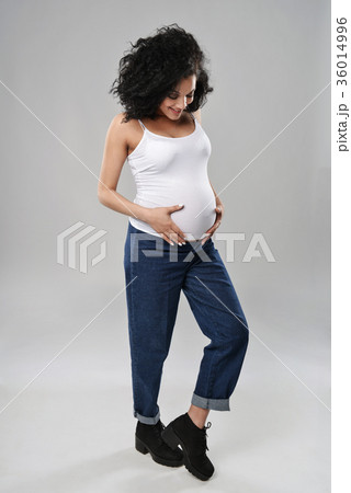 Pregnant woman standing in full length 36014996
