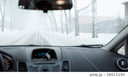 Bad weather driving in winter. Fog on the road 36015194