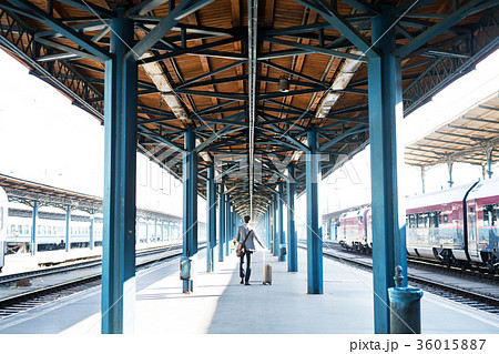 Mature businessman on a train station. Mature businessman on a train station. 36015887