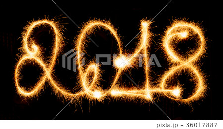 2018 with sparklers on black background 36017887