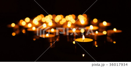 Burning candles with shallow depth of field 36017934