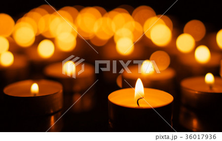 Burning candles with shallow depth of field 36017936