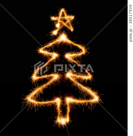 Christmas tree made by sparkler on a black Christmas tree made by sparkler on a black 36017939