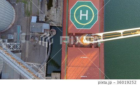 Aerial view of big grain elevators on the sea Aerial view of big grain elevators on the sea 36019252