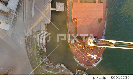 Aerial view of big grain elevators on the sea Aerial view of big grain elevators on the sea 36019256