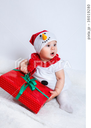 happy baby in snowman costume with christmas 36019280