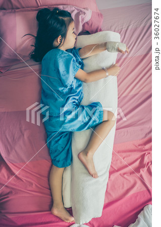 Asian child admit in hospital with IV drip on hand 36027674