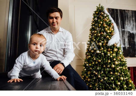 Father and child play Christmas. Dad holds a boy 36033140