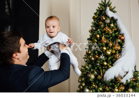 Father and child play Christmas. Dad holds a boy 36033144