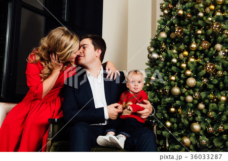 Portrait of a family on a christmas tree Portrait of a family on a christmas tree 36033287