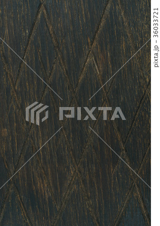 Dark toned natural oak wood texture with notches Dark toned natural oak wood texture with notches 36033721