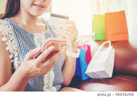 Woman shopping online using smartphone Woman shopping online using smartphone 36036208