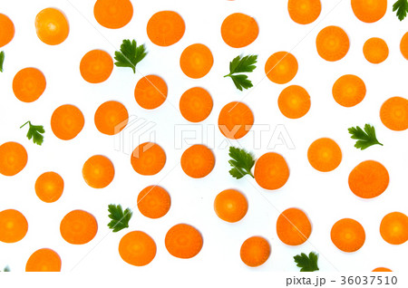 Carrot slices and parsley on white background 36037510