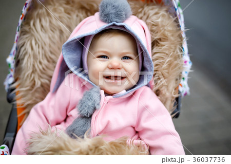 Cute little beautiful baby girl sitting in the Cute little beautiful baby girl sitting in the 36037736