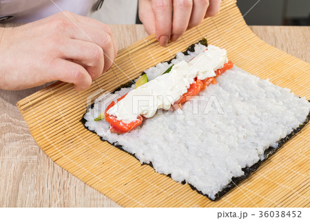 Chef prepares rolls, hands closeup Chef prepares rolls, hands closeup 36038452