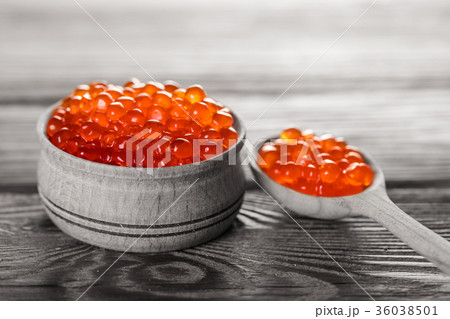 red caviar in a wooden bowl 36038501