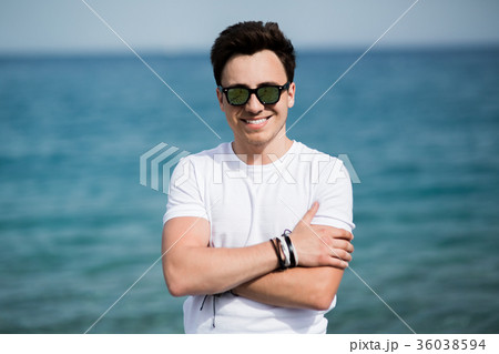 Portrait of young handsome man in sunglasses Portrait of young handsome man in sunglasses 36038594